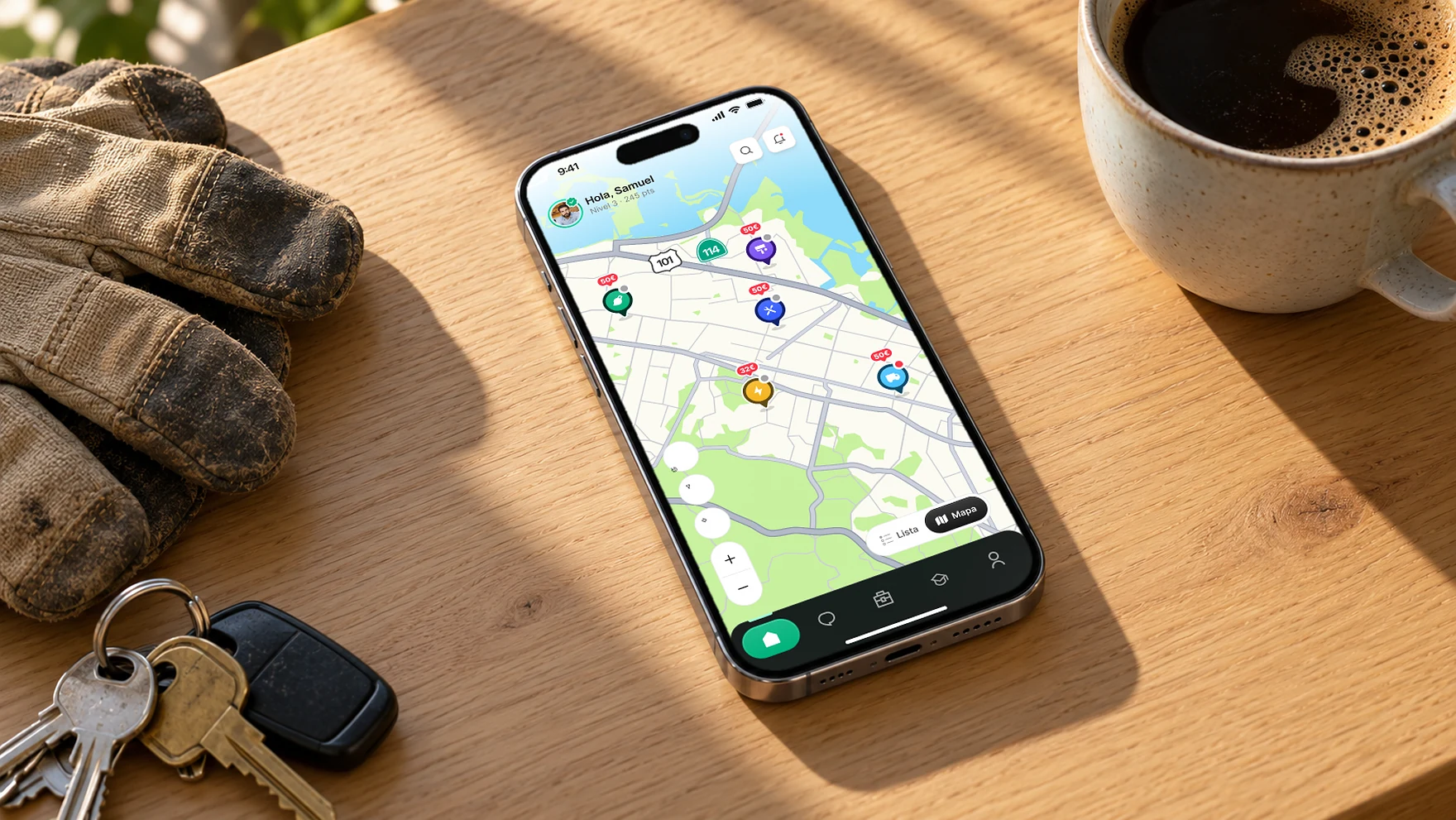 Microjob map on an iPhone resting on a wooden table next to keys and a coffee