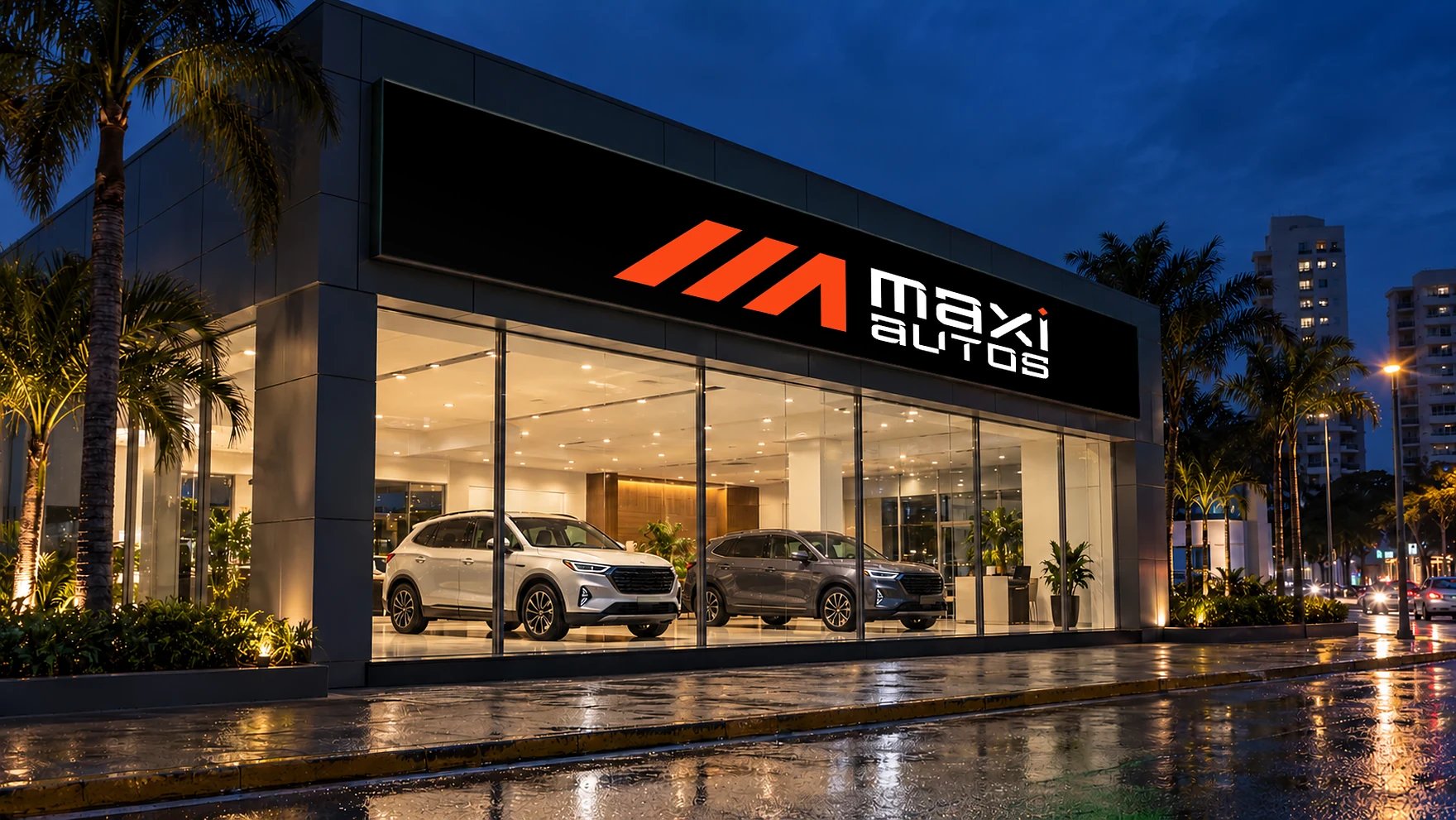 Maxiautos showroom at night with the logo lit on the façade
