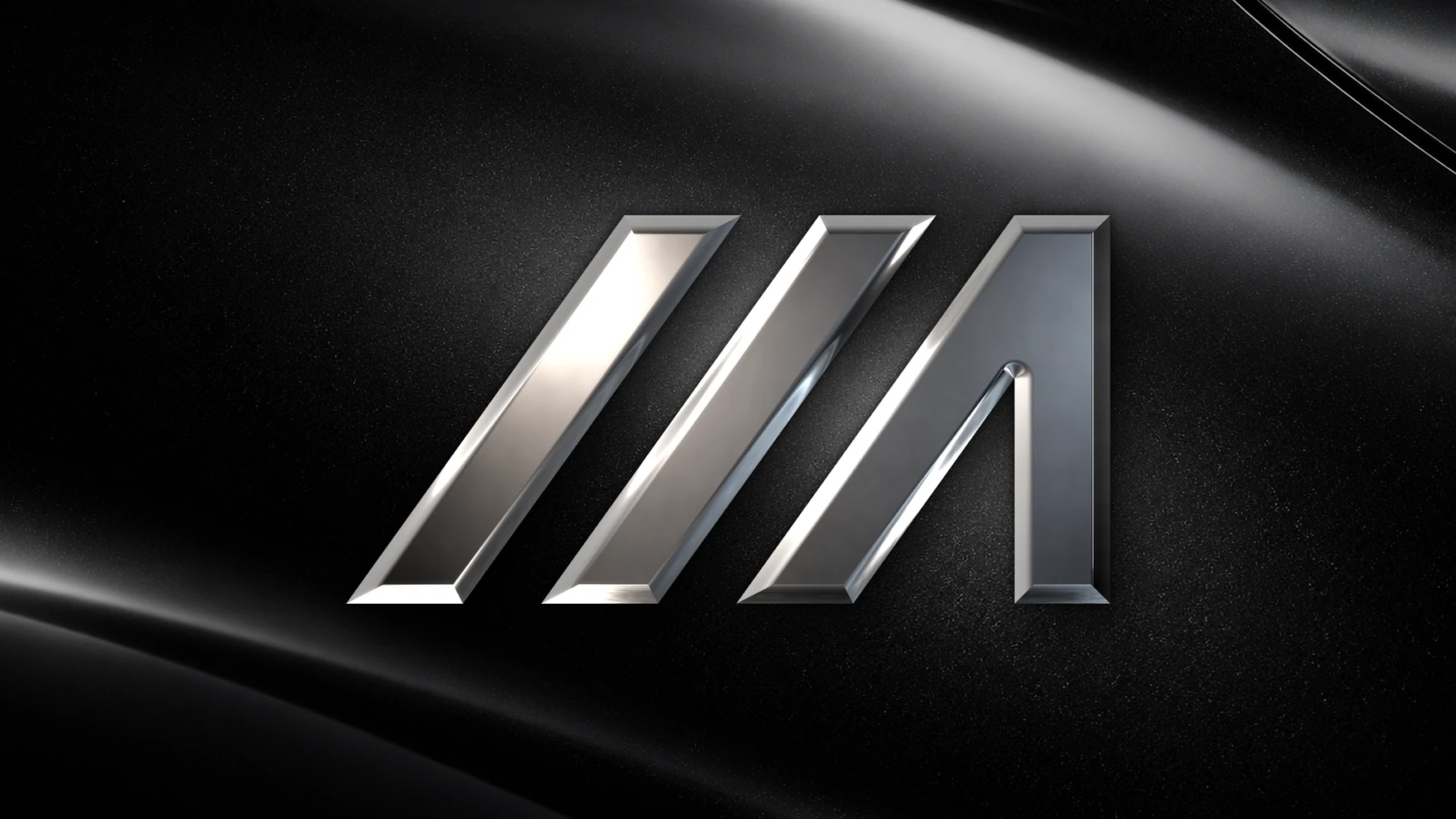 The Maxiautos isotype in chrome, in relief on a black metallic car body panel